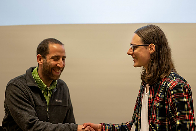 Student Oscar Gal, recipient of the Math Excellence award, shakes hands with Professor Gil Rosenberg during the academic award ceremony, Spring 2022.