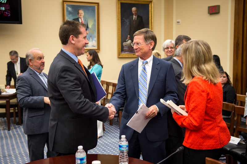 Dr. Eden shakes hands with Lamar Smith
