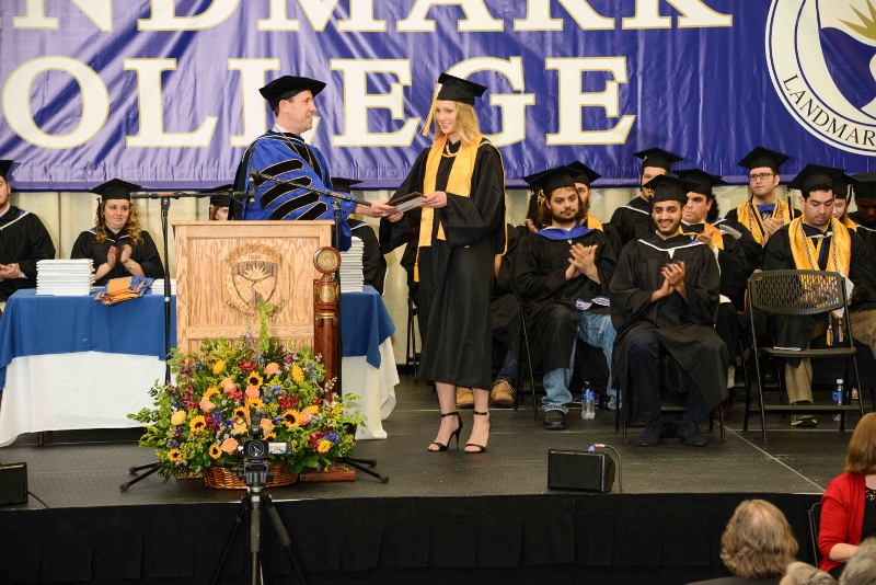 Elizabeth Bellingham on stage during graduation receiving her award
