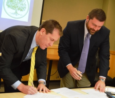 President Eden and Headmaster at Greenwood School sign MOU