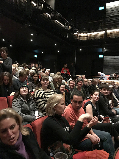 Students on the 2020 London Study Abroad trip smile for the camera as they are seated inside the Kiln Theater awaiting the start of the show.