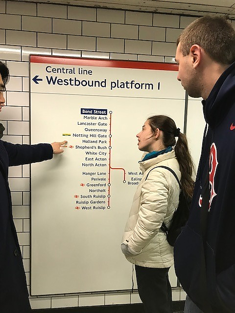 Photograph of students looking at the Tube map of the London Underground
