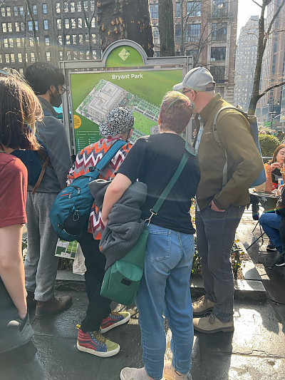 Students standing in front of public map labeled Bryant Park