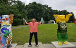 One of the Landmark College students on the Germany study abroad trip poses with life-size bear figurines during a visit to the Olympic Stadium in Berlin.  