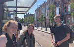 Three students on the Netherlands Study Abroad trip posing for a photo on an outdoor train platform