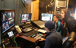 Landmark College students in the broadcast control room at Brattleboro Community Television.