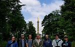 Students on the summer 2018 study abroad trip to Germany pose for the camera with the Berlin Victory Column in the background.  