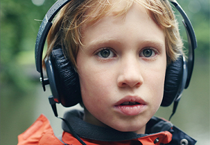 Image of young boy wearing headphones