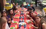 Students gathered around a table for a meal during their J-term Study Abroad trip to Costa Rica.