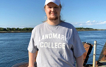 Reece Rountree-Hanscom standing on a pier in his hometown of Sandwich, Massachusetts