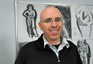 Headshot of Samuel Rowlett with drawings in background