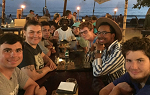 students at dinner on the beach