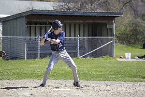 Landmark College student at bat at Dummerston baseball field