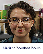 Headshot of Mariana Bourbon Bours, a woman with reddish frame glasses and brown hair cut above shoulder length