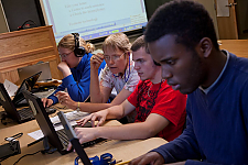 Landmark College professor and students in computer lab looking at screens