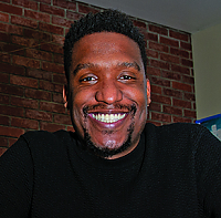 Headshot of Marc Thurman, a Black male with mustache and goatee