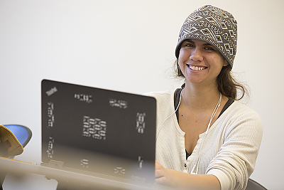 Young woman working at a laptop computer
