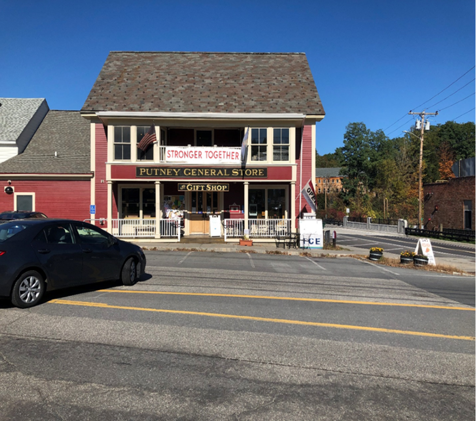 Exterior of Putney General Store with Stronger Together banner 