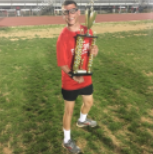 Jason DeWald holding a trophy